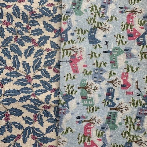 Two fabric swatches with holly leaf pattern and village scene design.