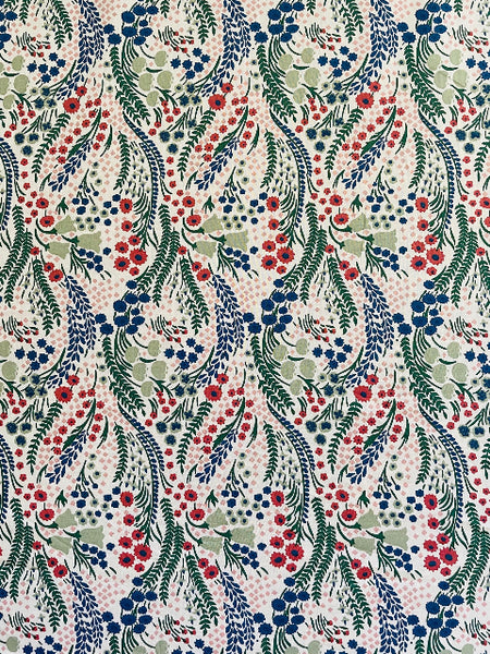 Floral pattern with red, blue, and green flowers on a beige background