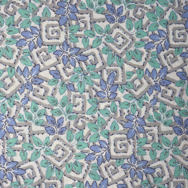 Patterned fabric with blue and green leaves on a gray background