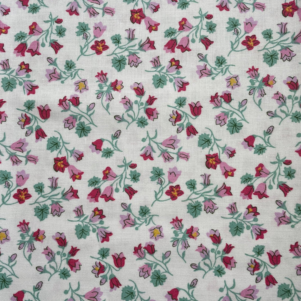 Floral pattern with red and pink flowers on a white background