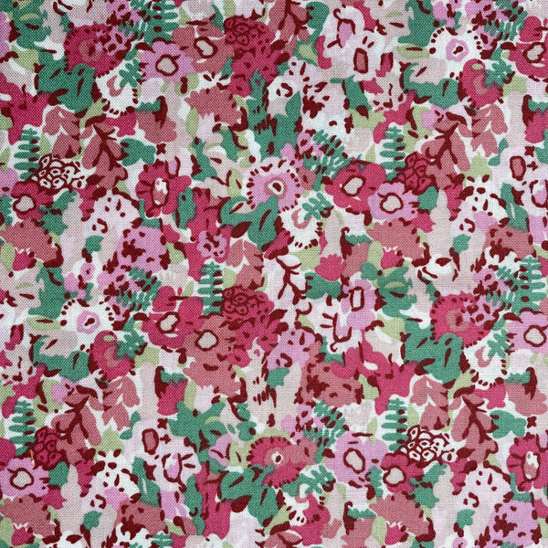Floral pattern with pink, green, and white colors on a fabric background