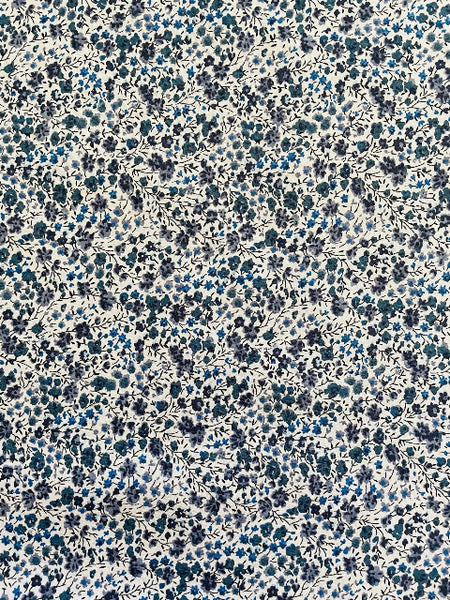 Floral pattern with small blue flowers on a white background